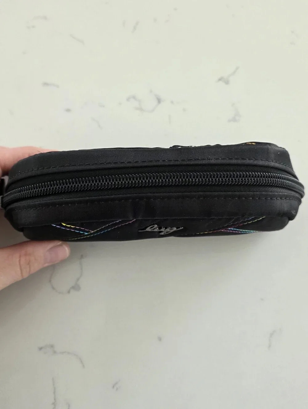 Lug Bob sled glasses case with rainbow stitching.